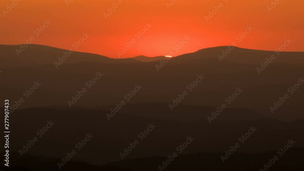 Orange sunset over mountains nature Time lapse Orange sunset over mountains nature Time lapse