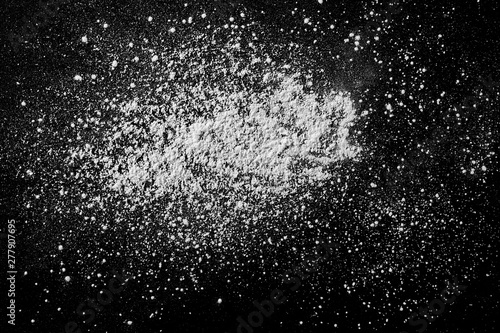 White powder isolated on black background  top view with clipping path
