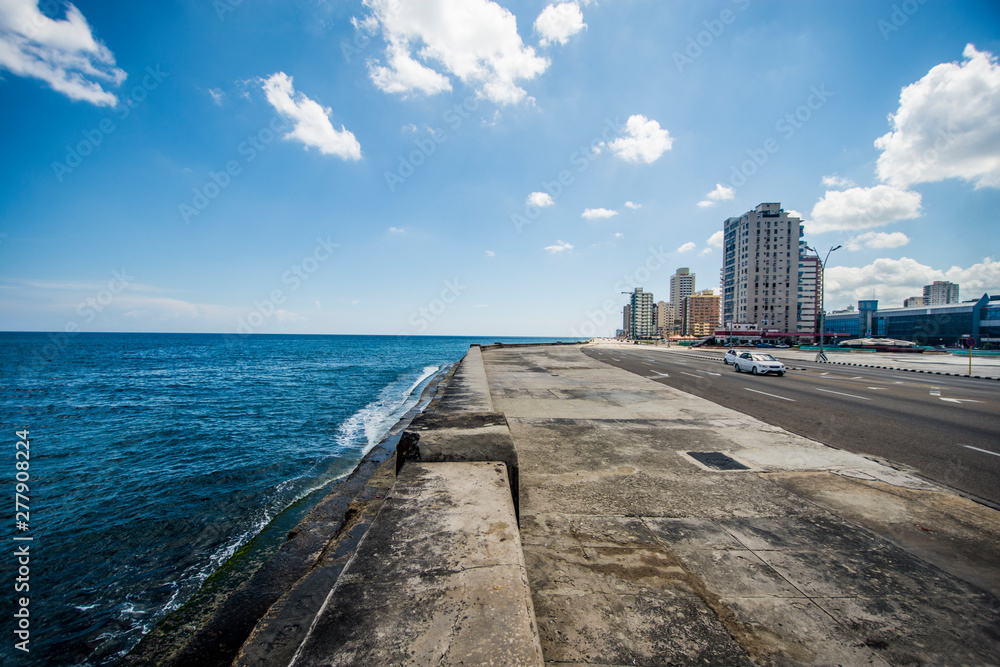 The Malecón or Avenida de Maceo is a broad esplanade, roadway and seawall which stretches for 5 miles along the coast in Havana, Cuba.