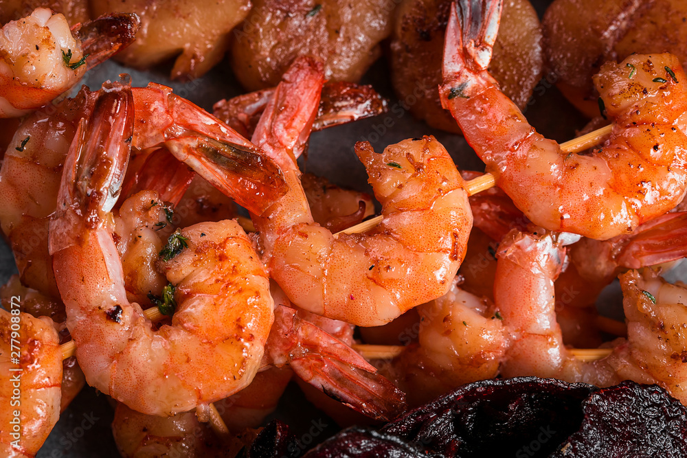 grilled shrimp skewers on a dark background grilled shrimp skewers on a dark background