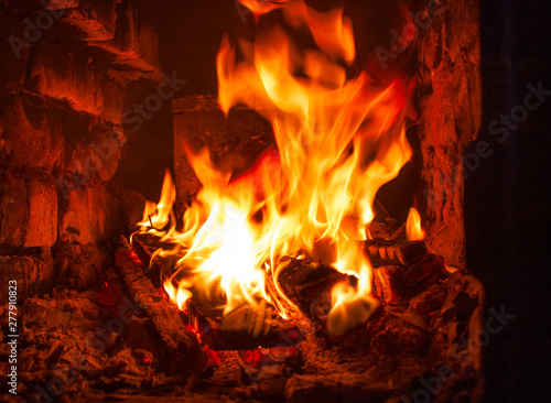 burning logs in the fireplace, the natural power of the fire