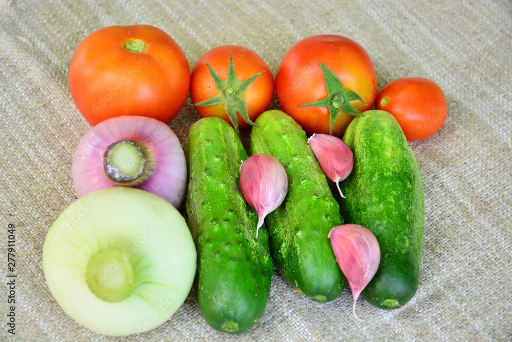 Fresh vegetables. Tomatoes, cucumbers, garlic, onions. Fresh vegetables. Tomatoes, cucumbers, garlic, onions.