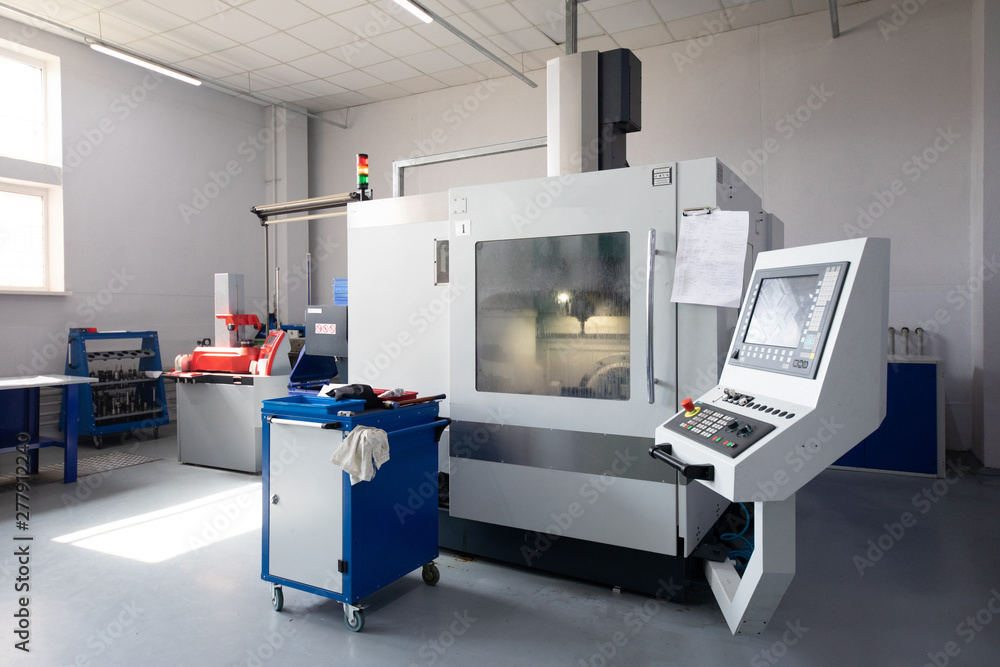 an interior shot of producing line of metal parts in modern plant an interior shot of producing line of metal parts in modern plant