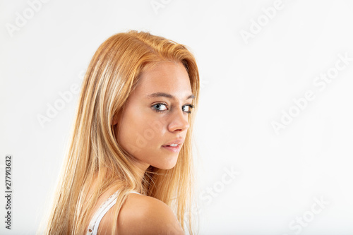 Attractive young woman glancing back