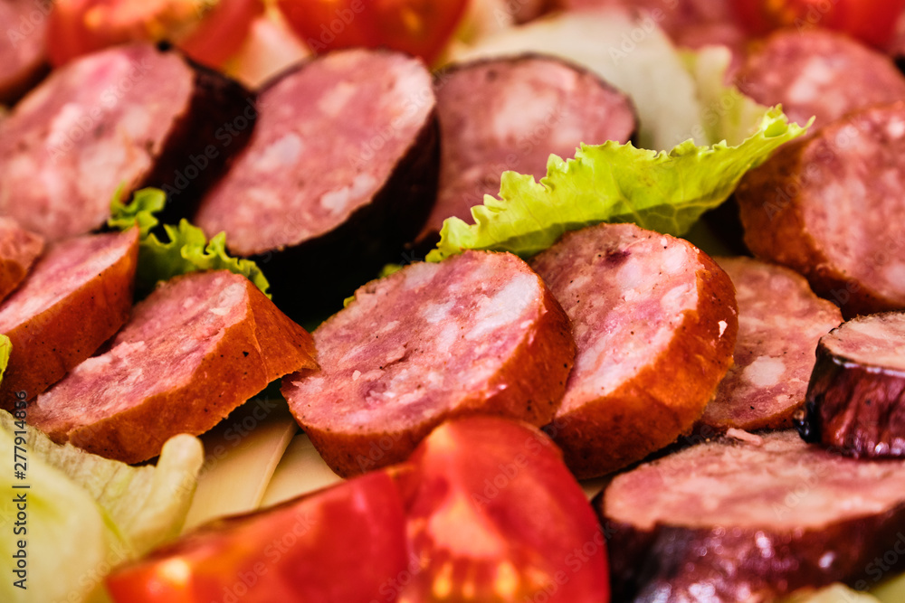 Sliced sausages with vegetables Sliced sausages with vegetables