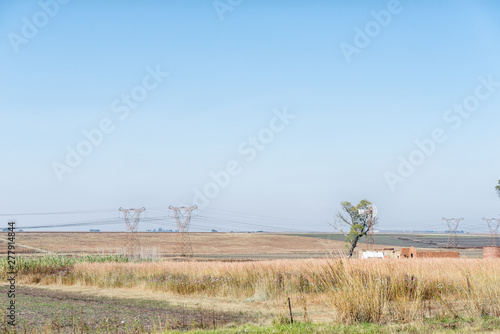 Landscape, with windmill, ruin and power route, on road R38