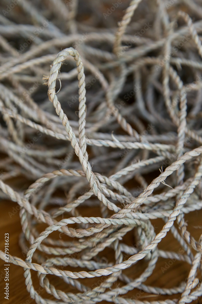 Tangled and twisted thin rope, close-up 