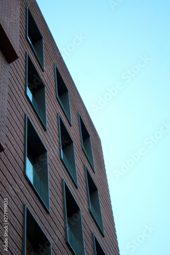 Masonry building facade detail with square windows pattern