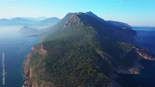 Wallpaper Mural Aerial view of Torre del Pirata, an old tower on the top of a cliff, in front of the islet of Es Vedra, in the island of Ibiza, with a beautiful sunset. Torontodigital.ca