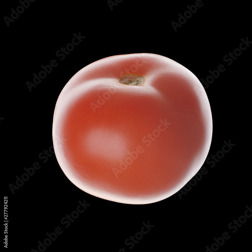 Tomato isolated on black. Without leaves. Side view. Close up.