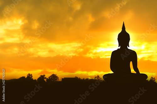 Asalha Puja Day concept , Silhouette largest Buddha image in the sunrise background in Thailand - Asia © Anucha