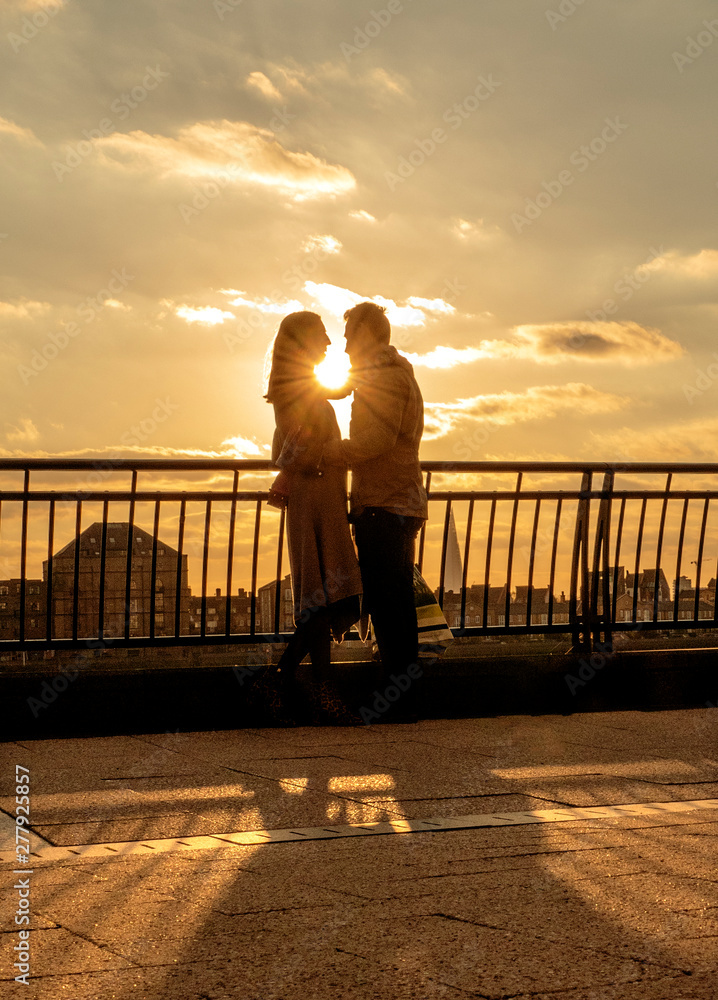 Fototapeta premium young couple at sunset