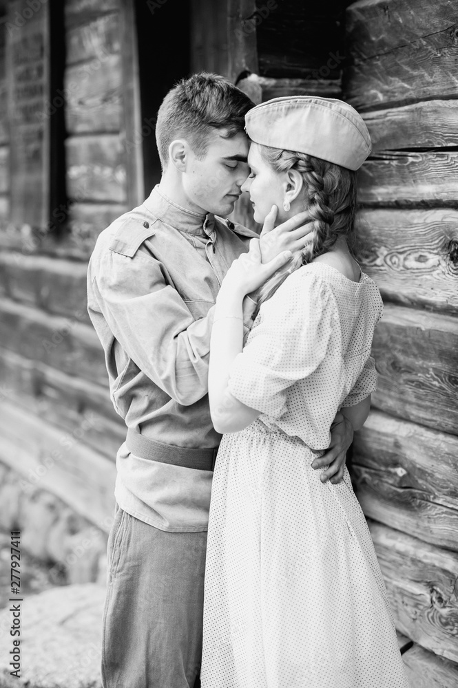 Husband hugs wife in the army Black and White