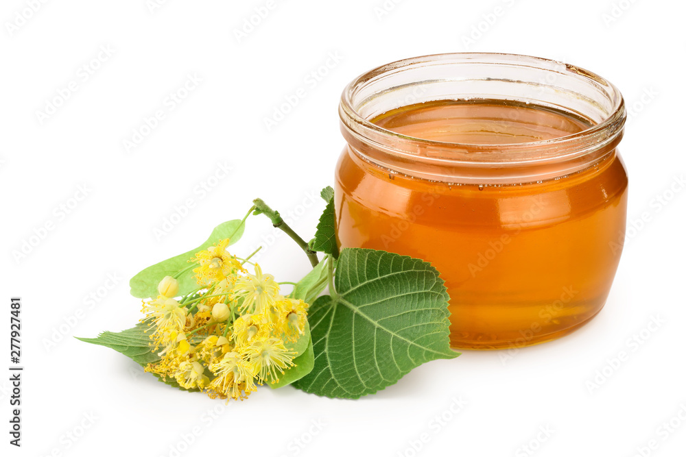 Honey with linden flowers isolated on white background. Honey with linden flowers isolated on white background.