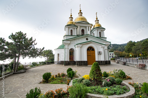 Golden Dome white church on the sky background