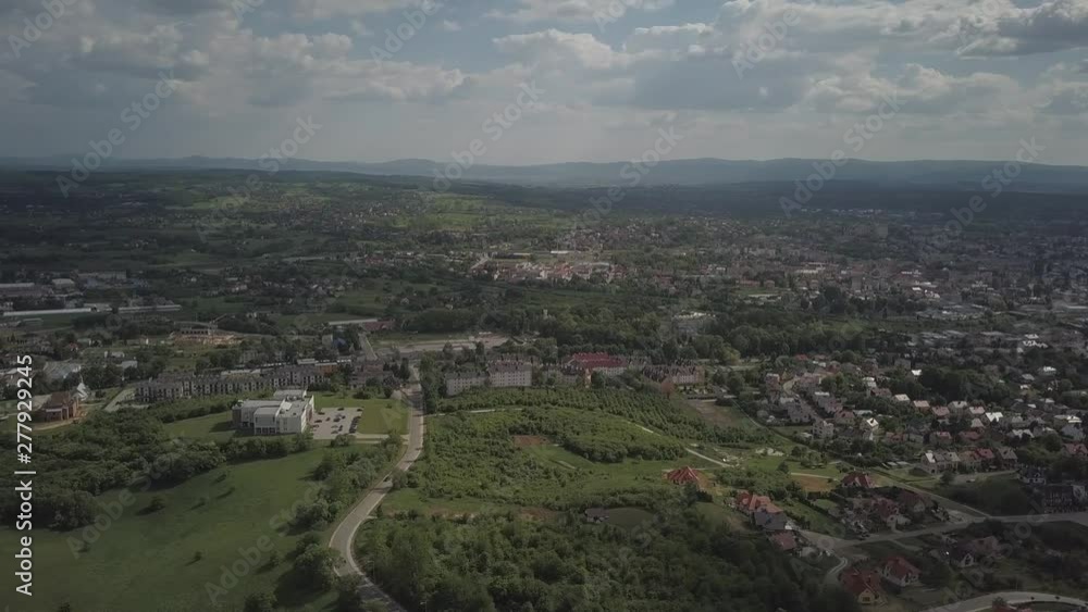 Panorama from a bird's eye view. Central Europe: The Polish town of Jaslo is located among the green hills. Temperate climate. Flight drones or quadrocopter. Panorama from a bird's eye view. Central Europe: The Polish town of Jaslo is located among the green hills. Temperate climate. Flight drones or quadrocopter.