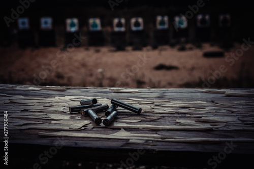 homemade shooting range in the open air with cartridge cases in the foreground