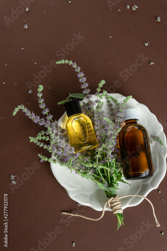Top view of bottles with mint essential oil. Massage cosmetic treatment