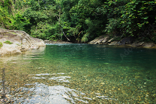 Ton Kloi Waterfall  in the forest at Ban Siam Ranong Thailand. Used in editing.Create a graphic Creative travel business