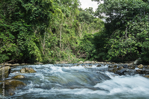 Ton Kloi Waterfall  in the forest at Ban Siam Ranong Thailand. Used in editing.Create a graphic Creative travel business