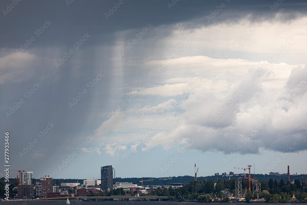 Summer day raining viewed from far Summer day raining viewed from far