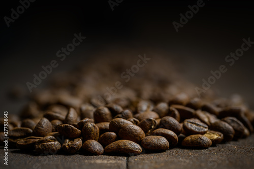 Coffee beans on wood backgr...