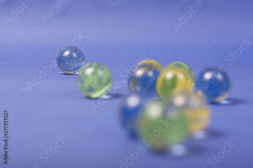 marbles on a blue background © GaragedayStudio