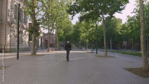 Wallpaper Mural Young Businessman Riding on Electric Scooter in City 3 Torontodigital.ca