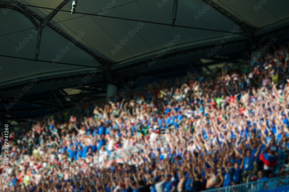 Naklejka premium Blurred crowd of spectators on a stadium