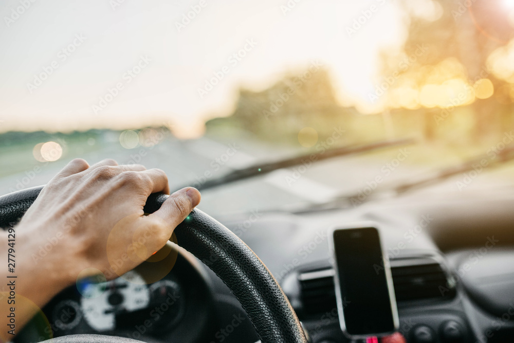 concept of traveling by car. driver driving on a sunny day. concept of traveling by car. driver driving on a sunny day.