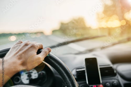 concept of traveling by car. driver driving on a sunny day.