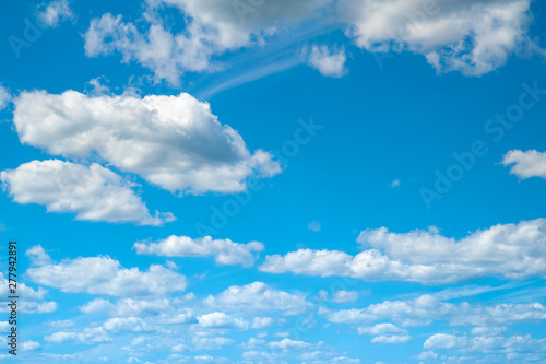 Clouds in the blue sky. Blue sky and many clouds in windy weather in the summer. © Alex Puhovoy