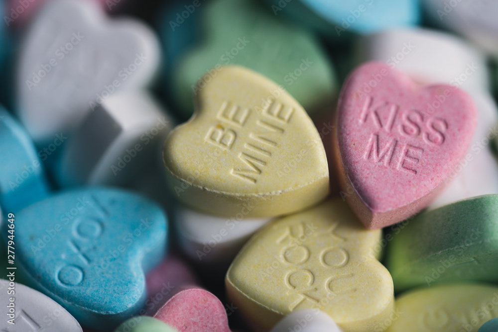Close up of candy hearts with Valentine's messages on them. Close up of candy hearts with Valentine's messages on them.