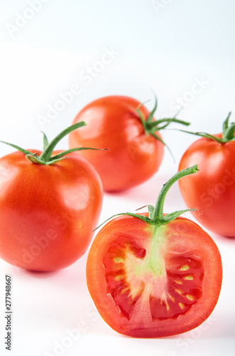 Fresh sliced tomatoes isolated on white background. Background of organic food.