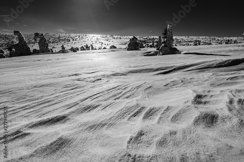 Beautiful winter mountain landscape of Krkonose National Park, Giant Mountains, Czech Republic. Labsky dul, Snezne jamy, Kotel and Snezka peaks covered in snow, Brigh day, blue sky, outdoor activity. photo