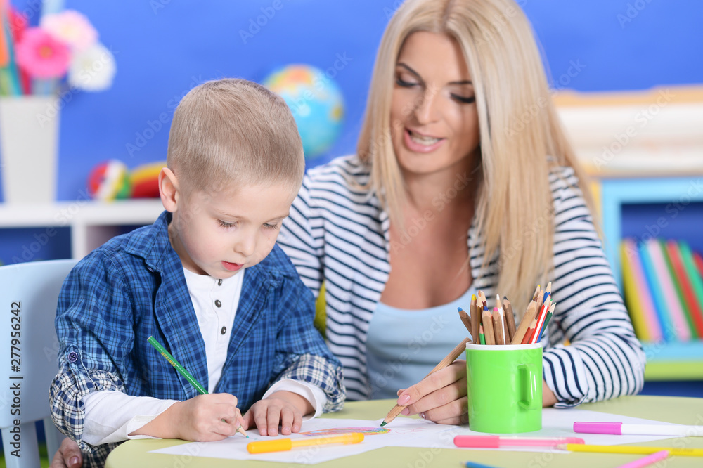 cute little boy playing with mother at home cute little boy playing with mother at home