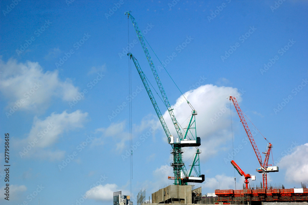 working crane against blue sky