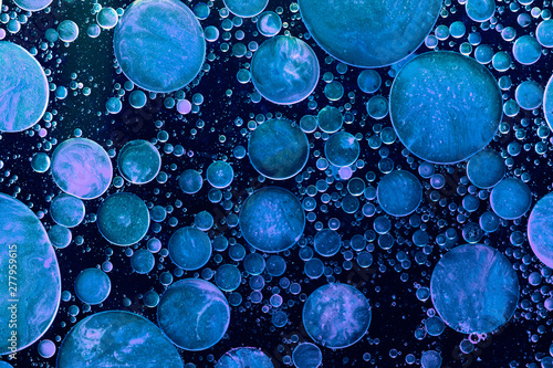 Blue liquid bubbles abstract background. Macro photography