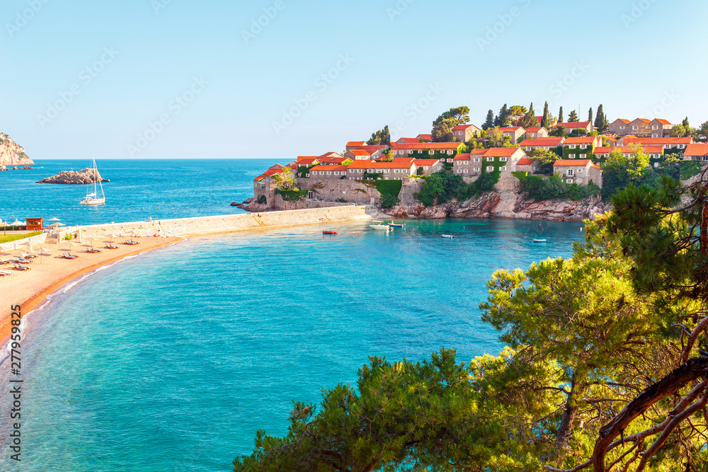 Picturesque summer view to the Sveti Stefan island with private beach, luxury resort on the Adriatic sea coast in Montenegro
