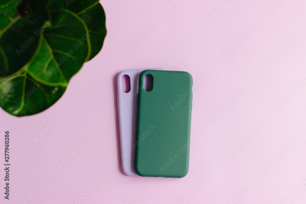 Two silicone cases on pastel background. Two silicone cases on pastel background.