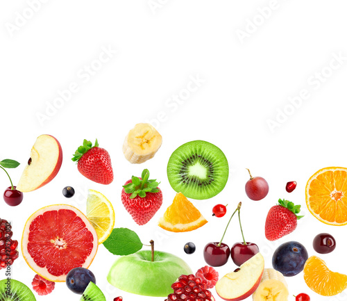 Fototapeta Naklejka Na Ścianę i Meble -  Mixed fruits on white. Falling fruits.