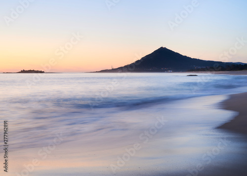 Sunset at the Moledo beach  with a mountain on backgroud