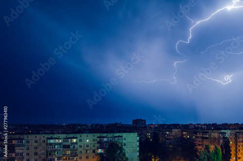 Thunderstorm with lightning and thunder over the night city