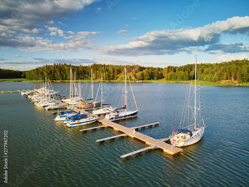 Scenic aerial view of colorful boats near wooden berth