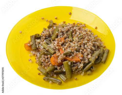 buckwheat with green beans with garlicand carrots isolated on white background. Diet breakfast on a plate.  food vegetarian top view photo