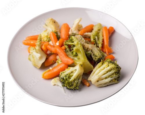 provencal vegetables on a plate.grilled vegetables on a plate isolated on white background.broccoli and carrots on a plate top view.healthy  food