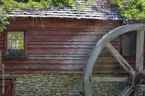 Red Building With A Water Wheel photo