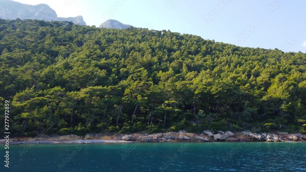 A tracking shot of the idyllic Aegean coast in the summer, from Gulf of Gokova. Shot and presented at 60 fps. A tracking shot of the idyllic Aegean coast in the summer, from Gulf of Gokova. Shot and presented at 60 fps.