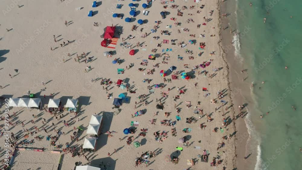 Aerial of people relaxing at the beach Aerial of people relaxing at the beach
