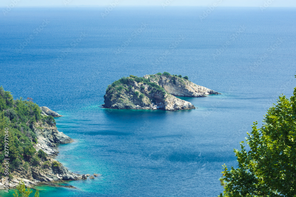Summer vacation view of a small island in the sea